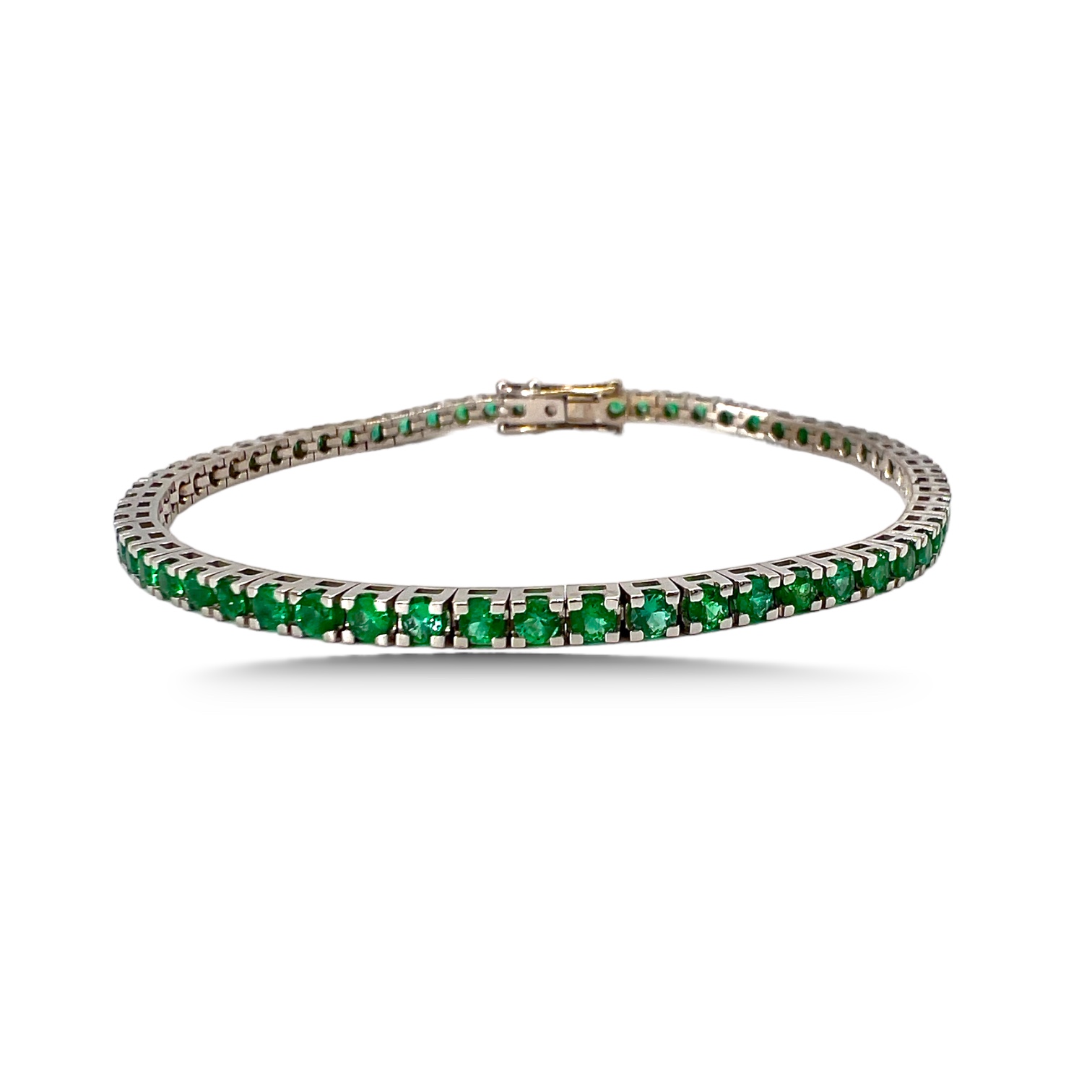 Emerald tennis bracelet in gold art. BR464